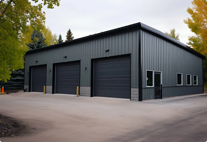 grey 3 door garage/workshop with slate doors