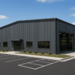 cold formed steel commercial building, slate grey paint with a few square windows and doorway storefront entrance